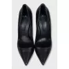 Black shoes with a curved heel