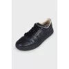 Black leather sneakers