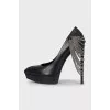 Leather high heels decorated with chains
