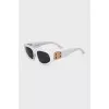 White sunglasses with brand logo