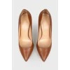Caramel colored leather pumps