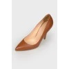 Caramel colored leather pumps