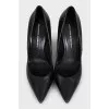 Black leather pointed toe pumps