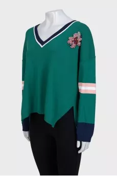 Oversized pullover decorated with crystals