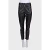 Black trousers with colored leather inserts