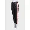 Black trousers with colored leather inserts
