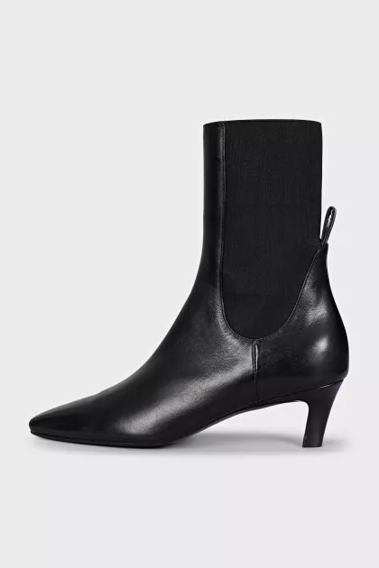 Black leather ankle boots with a square toe