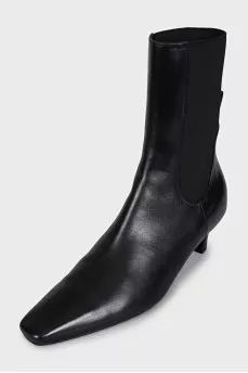 Black leather ankle boots with a square toe