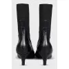 Black leather ankle boots with a square toe