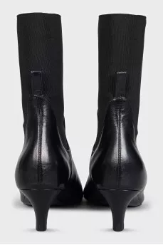 Black leather ankle boots with a square toe