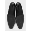 Black leather ankle boots with a square toe