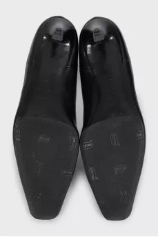 Black leather ankle boots with a square toe
