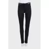 Black jeans with silver trim on the waistband