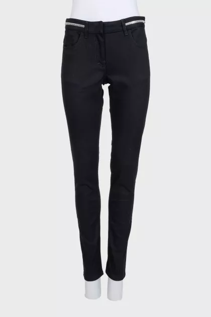 Black jeans with silver trim on the waistband