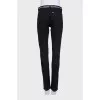 Black jeans with silver trim on the waistband