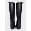 Black leather boots with signature buckle