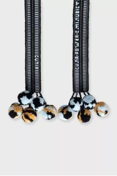 Blue textile belt with pom-poms