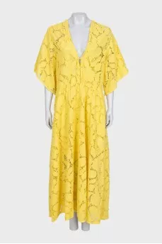 A loose-fitting lace dress with buttons