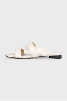 Beige leather flip-flops