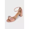 Beige patent leather sandals with a bow