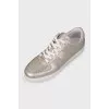 Leather sneakers with embossed logo