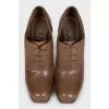 Brown leather ankle boots with heels