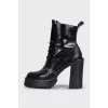 Black leather ankle boots with brand logo