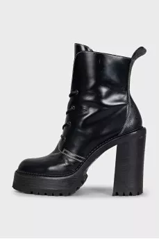 Black leather ankle boots with brand logo
