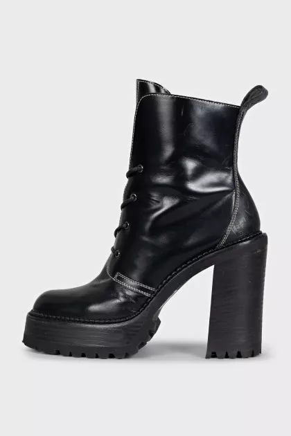 Black leather ankle boots with brand logo