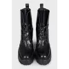 Black leather ankle boots with brand logo