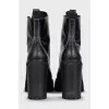 Black leather ankle boots with brand logo