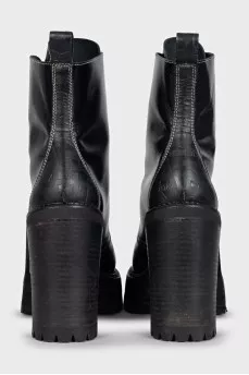 Black leather ankle boots with brand logo
