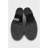 Black leather ankle boots with brand logo