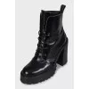 Black leather ankle boots with brand logo