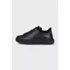Black sneakers with fur and embossing