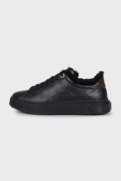 Black sneakers with fur and embossing