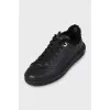 Black sneakers with fur and embossing