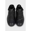 Black sneakers with fur and embossing