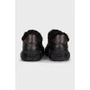 Black sneakers with fur and embossing