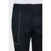 Black trousers with white stitching
