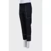 Black trousers with white stitching