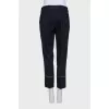 Black trousers with white stitching