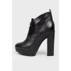 Black lace-up ankle boots