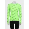 A fitted long sleeve top with a signature print