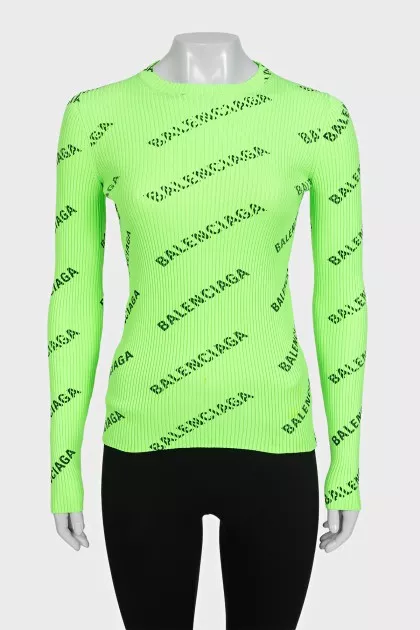 A fitted long sleeve top with a signature print