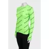 A fitted long sleeve top with a signature print