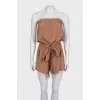 Brown jumpsuit with an open top