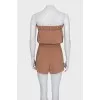 Brown jumpsuit with an open top