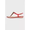 Red sandals with metallic decor