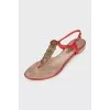 Red sandals with metallic decor